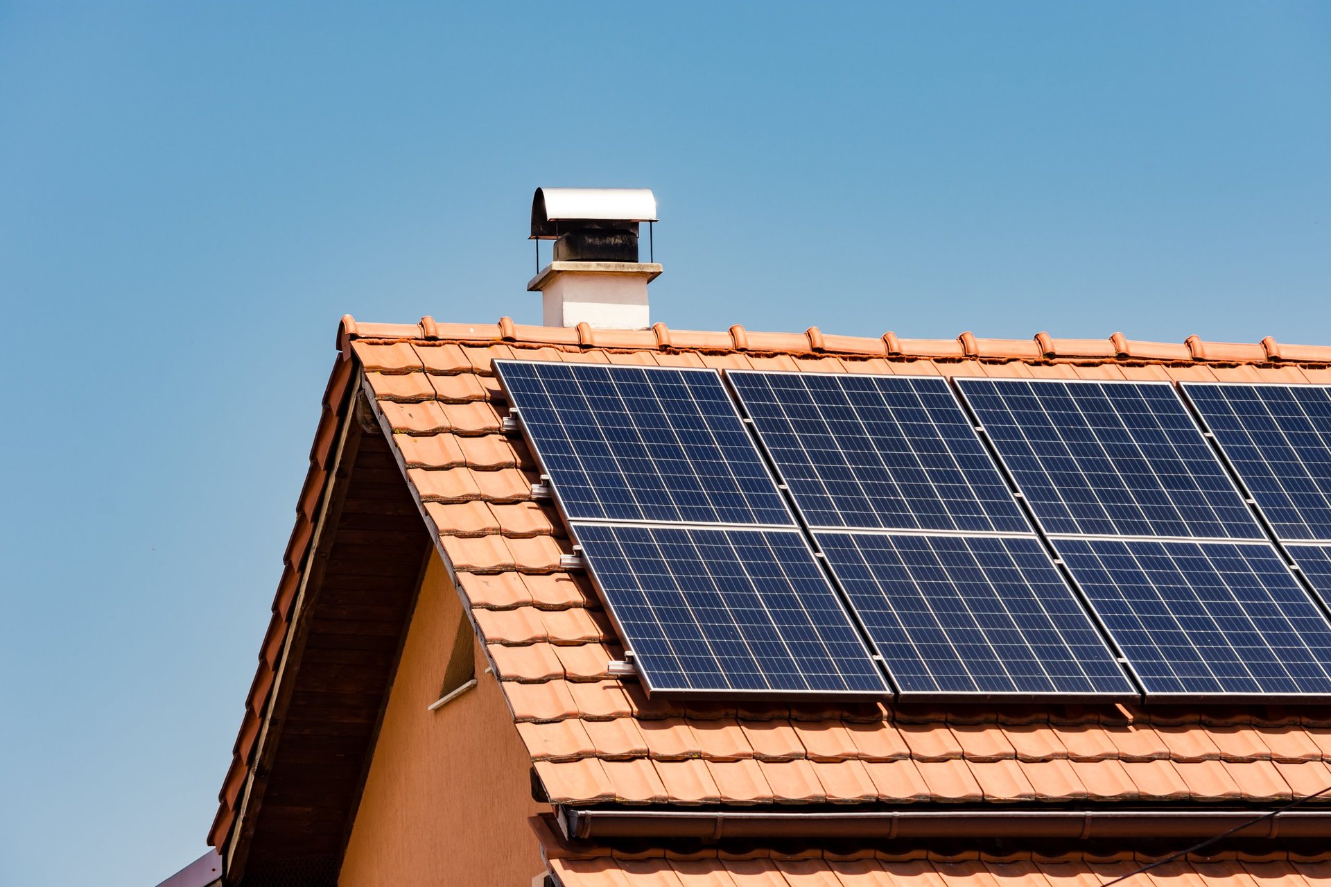 Solar panel installation on modern home roof