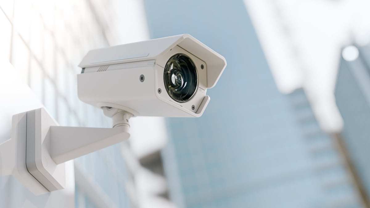 CCTV security camera installed on building exterior wall for surveillance